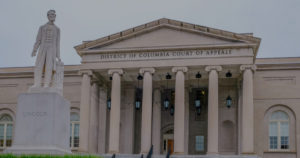 Exterior image of the District of Columbia Court of Appeals with statue of Abraham Lincoln in front, just to the left